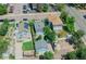 A high angle view of a neighborhood featuring houses with mature trees and nearby street parking at 4079 S Bannock St, Englewood, CO 80110
