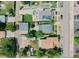 Aerial view showcasing neighborhood homes with solar panels and mature trees at 4079 S Bannock St, Englewood, CO 80110