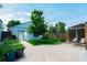 Private backyard featuring a concrete patio and a pergola with outdoor seating for relaxation at 4079 S Bannock St, Englewood, CO 80110