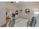 Bedroom with modern decor, neutral colors, and hardwood floors; access to living and bath at 4079 S Bannock St, Englewood, CO 80110
