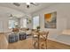 Stylish dining area showcasing hardwood floors and seamless flow into the living space at 4079 S Bannock St, Englewood, CO 80110