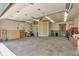 Spacious garage with concrete floor, storage shelves, and overhead door at 4079 S Bannock St, Englewood, CO 80110