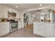 Updated kitchen with stainless appliances, breakfast bar, and plenty of cabinet space at 4079 S Bannock St, Englewood, CO 80110