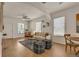 Bright living room featuring hardwood floors and seamless flow into the dining space at 4079 S Bannock St, Englewood, CO 80110