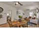 Inviting view from the dining area to the bright living room with stylish decor and hardwood floors at 4079 S Bannock St, Englewood, CO 80110