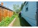 Side yard featuring artificial grass and wood fence at 4079 S Bannock St, Englewood, CO 80110