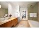 Modern bathroom features mosaic tile shower, sleek vanity, and luxurious soaking tub at 1133 14Th St # 2300, Denver, CO 80202