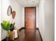 Welcoming hallway is decorated with stylish mirrors and a bench with plant decor at 1133 14Th St # 2300, Denver, CO 80202