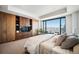 Spacious main bedroom boasts custom built-ins and a large window with city views at 1133 14Th St # 2300, Denver, CO 80202