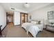 Relaxing bedroom with a large bed, closet and adjoining bath at 1133 14Th St # 2300, Denver, CO 80202