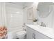 Bright bathroom with a shower-tub combination and modern vanity at 2034 Espana Way, Aurora, CO 80011