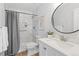 Updated bathroom featuring a shower, stylish vanity, and modern fixtures at 2034 Espana Way, Aurora, CO 80011