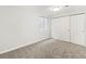 Bedroom with carpet, window and closet at 2034 Espana Way, Aurora, CO 80011