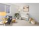 Cozy Bedroom featuring a comfortable chair, crib, and calming decor at 2034 Espana Way, Aurora, CO 80011
