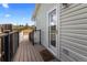 Side deck with wooden floor and metal railing at 2034 Espana Way, Aurora, CO 80011