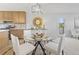 Dining room with modern light fixture and a table with seating for four at 2034 Espana Way, Aurora, CO 80011