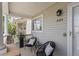 Charming front porch features seating and a view of the house number at 2034 Espana Way, Aurora, CO 80011