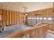 Unfinished garage space showing potential for customization with shelving and overhead door at 2034 Espana Way, Aurora, CO 80011