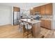 Modern kitchen features a large island with seating and lots of cabinet space at 2034 Espana Way, Aurora, CO 80011