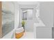Bright laundry room with stacked washer and dryer and view to backyard at 2034 Espana Way, Aurora, CO 80011