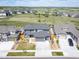 An aerial view of a contemporary home in a new development, surrounded by open space and mountain views at 14391 Shasta Daisy Pt, Parker, CO 80134