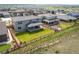 Aerial view of a fenced backyard with a pergola and outdoor seating area, backing to open space at 14391 Shasta Daisy Pt, Parker, CO 80134