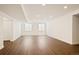 Spacious unfinished basement area with wood floors, offering potential for customization at 14391 Shasta Daisy Pt, Parker, CO 80134