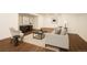 Finished basement area with stylish furniture, creating a cozy and inviting living space at 14391 Shasta Daisy Pt, Parker, CO 80134
