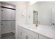 Bright bathroom featuring a vanity with gold fixtures and a walk-in shower at 14391 Shasta Daisy Pt, Parker, CO 80134