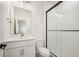 Modern bathroom with white subway tile shower and vanity with sleek gold hardware at 14391 Shasta Daisy Pt, Parker, CO 80134