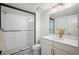 Bathroom showcasing a glass enclosed shower, sleek vanity and modern fixtures at 14391 Shasta Daisy Pt, Parker, CO 80134