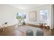 Bright bedroom featuring an area rug, a teepee, playful decor, and ample natural light from large windows at 14391 Shasta Daisy Pt, Parker, CO 80134