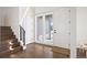 Inviting foyer with hardwood floors, a staircase, natural light, and modern finishes at 14391 Shasta Daisy Pt, Parker, CO 80134