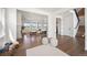 Inviting home foyer leading to an open-concept living area with a fireplace, hardwood floors, and modern decor at 14391 Shasta Daisy Pt, Parker, CO 80134