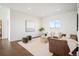 Bright living room featuring modern furnishings, hardwood floors, and a cozy atmosphere at 14391 Shasta Daisy Pt, Parker, CO 80134