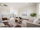 Open-concept living room with hardwood floors and stylish decor at 14391 Shasta Daisy Pt, Parker, CO 80134