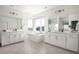 Luxurious primary bathroom with dual vanities, a soaking tub, elegant fixtures, and bright, natural light at 14391 Shasta Daisy Pt, Parker, CO 80134