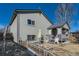 Exterior of a home with a covered deck, patio, and fenced yard, offering outdoor living spaces at 18890 E Carmel Cir, Aurora, CO 80011