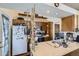 Functional kitchen featuring wood cabinets, a sink, and appliances including a stove and microwave at 18890 E Carmel Cir, Aurora, CO 80011