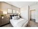 Cozy bedroom featuring plush carpet, natural light, accent pillows, and neutral color palette at 3379 N Denali St, Aurora, CO 80019