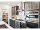 Modern kitchen showcasing stainless appliances, granite countertops, and plenty of cabinet space at 3379 N Denali St, Aurora, CO 80019