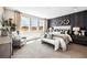 Cozy main bedroom with chair, three large windows, and plenty of sunlight at 3379 N Denali St, Aurora, CO 80019