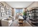 Cozy home office features a large window, decor, shelving, and neutral color palette at 3379 N Denali St, Aurora, CO 80019