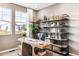 Bright home office featuring natural light, decor, shelving, and neutral color palette at 3379 N Denali St, Aurora, CO 80019