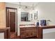 Upstairs bathroom boasts a vanity with sink, wooden cabinets, and a hanging pendant light at 107 N Harris St # 306, Breckenridge, CO 80424