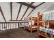 Bedroom with wooden bunk beds, a carpeted floor, and high ceilings at 107 N Harris St # 306, Breckenridge, CO 80424