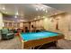 Brightly lit game room featuring a pool table and comfortable seating area at 107 N Harris St # 306, Breckenridge, CO 80424