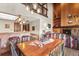 Living area with open floor plan featuring a fireplace, built-in shelves, dining area, and kitchen at 107 N Harris St # 306, Breckenridge, CO 80424