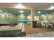 Bright indoor pool and hot tub with tile surround and ample seating space at 107 N Harris St # 306, Breckenridge, CO 80424