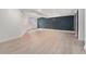 Spacious basement living area featuring light wood floors and recessed lighting at 13275 Holly St # B, Thornton, CO 80241